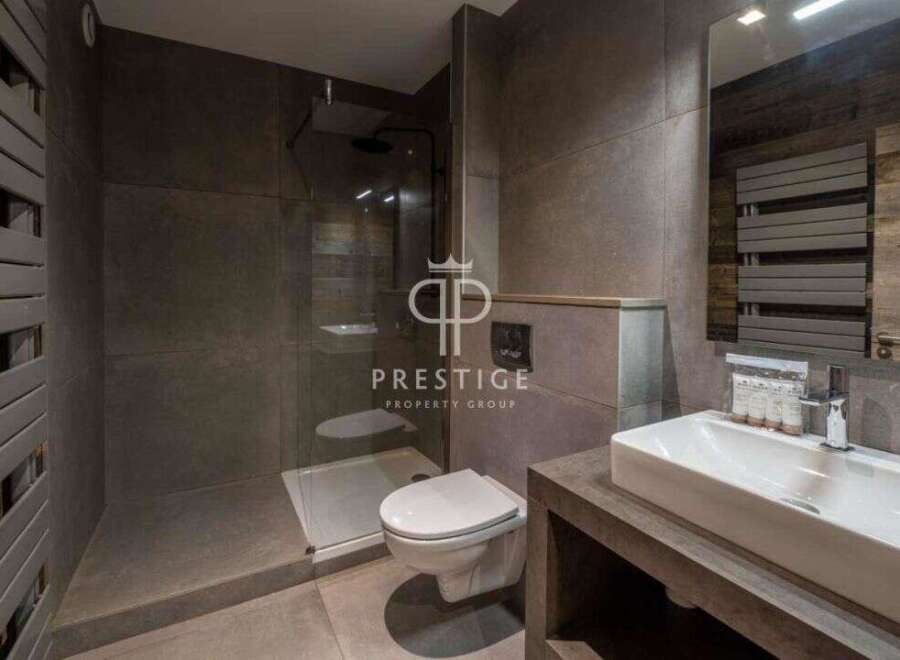 Discover luxury living in this stunning property! Featuring a modern bathroom with a sleek design, this space offers both style and functionality.