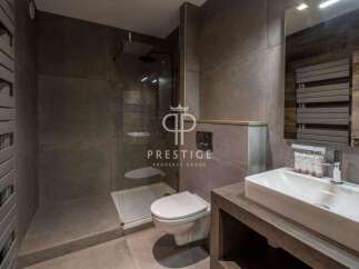 Discover luxury living in this stunning property! Featuring a modern bathroom with a sleek design, this space offers both style and functionality.