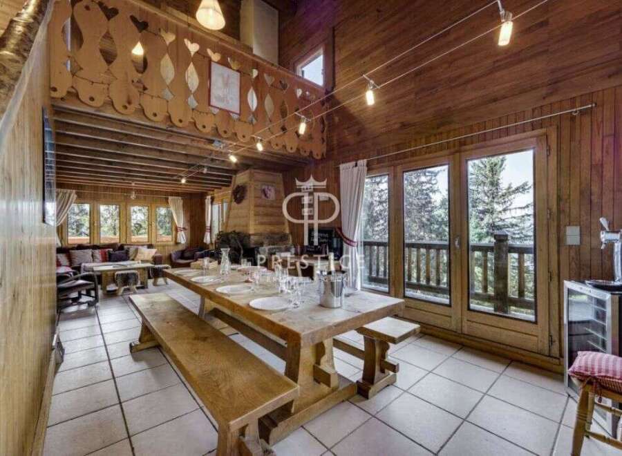 Experience the charm of this rustic chalet, featuring a spacious dining area perfect for gatherings.