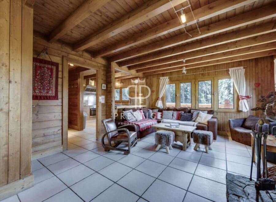 Step into a cozy haven with this stunning property, featuring warm wooden interiors and a welcoming atmosphere.