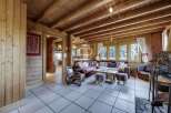 Step into a cozy haven with this stunning property, featuring warm wooden interiors and a welcoming atmosphere.