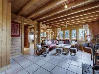 Step into a cozy haven with this stunning property, featuring warm wooden interiors and a welcoming atmosphere.