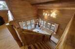 Discover the charm of this stunning wooden cabin, featuring a unique staircase design.