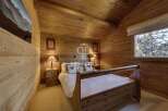 Experience rustic charm in this cozy bedroom.