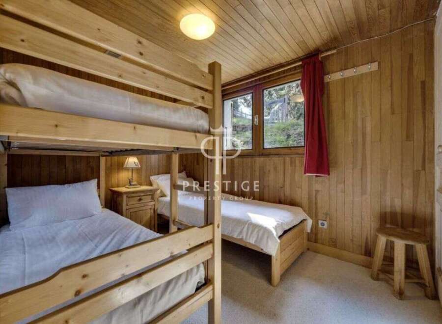Cozy bedroom featuring wooden bunk beds, perfect for a family or group.
