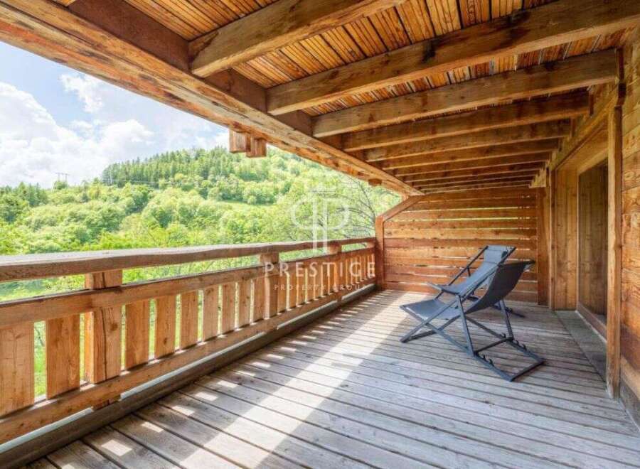 Enjoy breathtaking views from this stunning wooden balcony.
