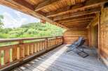 Enjoy breathtaking views from this stunning wooden balcony.