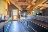 Discover the charm of this stunning kitchen, featuring exposed wooden beams and a modern design.