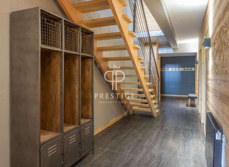Discover the charm of this property, featuring a stunning wooden staircase that adds warmth and character.