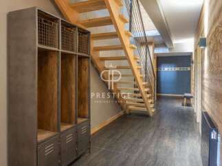 Discover the charm of this property, featuring a stunning wooden staircase that adds warmth and character.