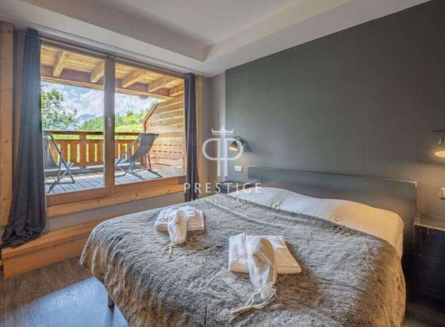 Discover a cozy bedroom with a stunning balcony view.