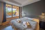 Discover a cozy bedroom with a stunning balcony view.