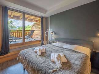 Discover a cozy bedroom with a stunning balcony view.