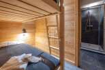Discover a cozy bedroom featuring a bunk bed with wooden accents, perfect for a comfortable stay.