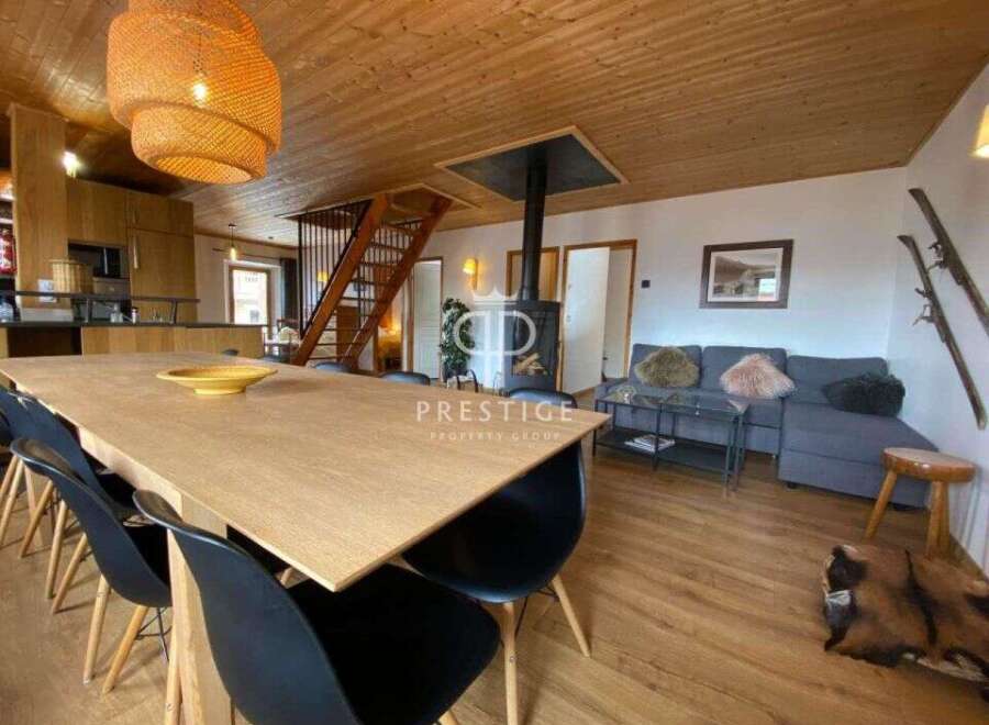 Discover the charm of this stunning property, featuring a spacious dining area perfect for gatherings.