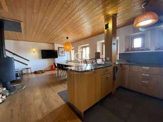 Discover the charm of this stunning property, featuring a warm wooden ceiling and flooring that exudes a cozy ambiance.