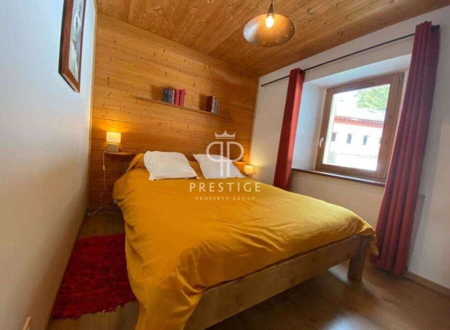 Cozy bedroom with wooden accents and a warm ambiance.