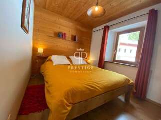 Cozy bedroom with wooden accents and a warm ambiance.
