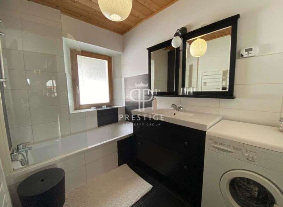 Discover a stylish bathroom featuring a sleek design.