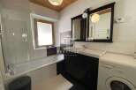 Discover a stylish bathroom featuring a sleek design.