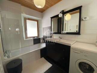 Discover a stylish bathroom featuring a sleek design.