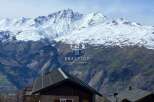 Discover your dream mountain retreat! This stunning property boasts breathtaking views of snow-capped peaks.