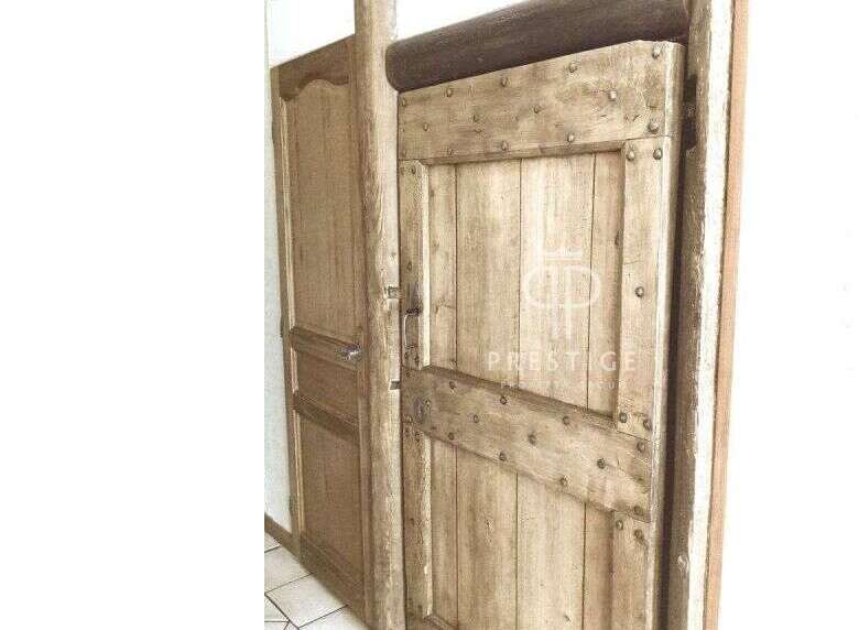 Discover the rustic charm of this property with its unique wooden doors.