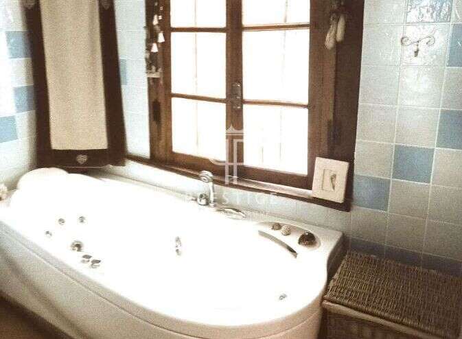 Relax and unwind in this luxurious bathroom featuring a modern jacuzzi tub.