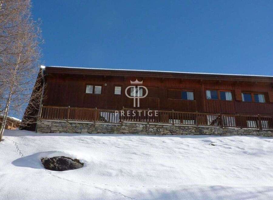 Discover a stunning property nestled in a snowy landscape.