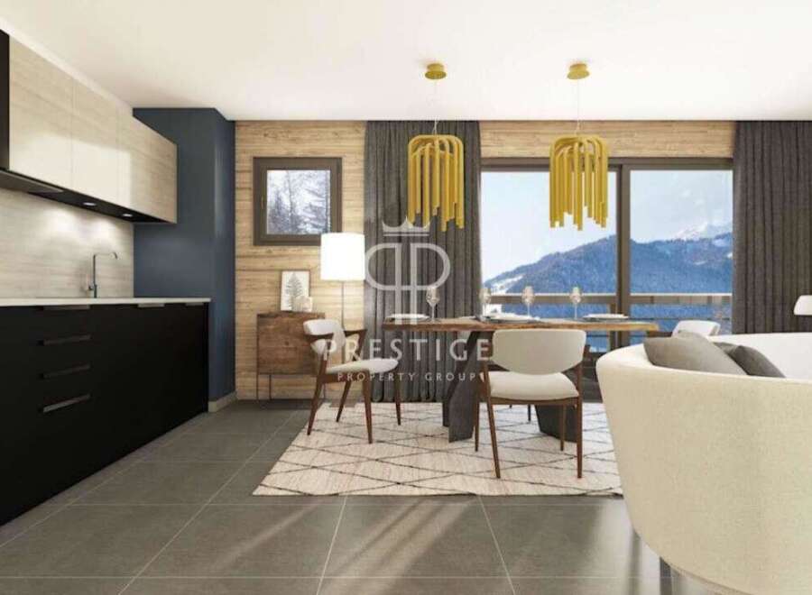 Experience luxury living in this stunning property, featuring a modern kitchen with sleek black cabinetry and a bright, airy dining area.