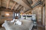 Experience rustic luxury in this stunning bedroom.