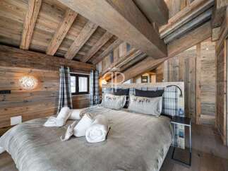 Experience rustic luxury in this stunning bedroom.