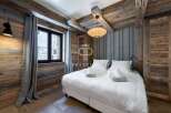 Experience rustic elegance in this stunning bedroom.