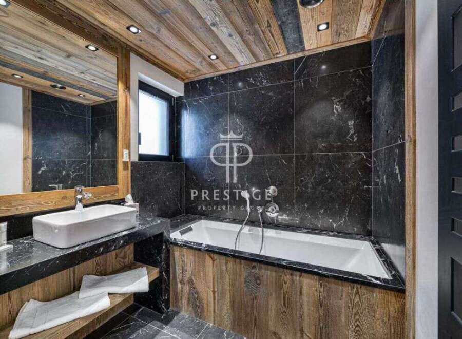 Discover luxury in this stunning bathroom featuring a sleek black marble design.