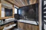 Discover luxury in this stunning bathroom featuring a sleek black marble design.