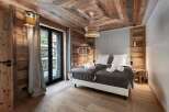 Experience rustic elegance in this stunning bedroom.
