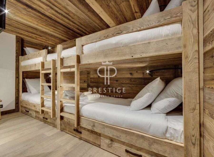 Discover the charm of this cozy bunk room, perfect for accommodating guests.