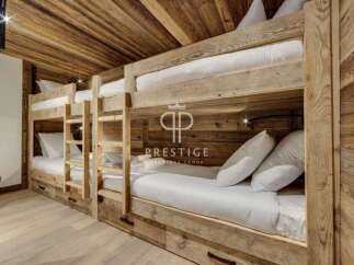 Discover the charm of this cozy bunk room, perfect for accommodating guests.