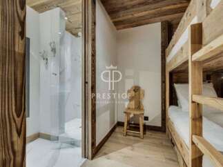 Discover the charm of this property, featuring a cozy bunk bed setup perfect for family or guests.