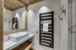 Discover luxury living in this stunning property, featuring a modern bathroom design.