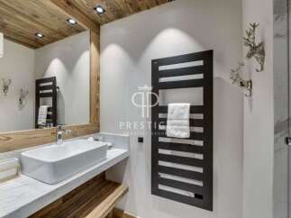 Discover luxury living in this stunning property, featuring a modern bathroom design.