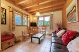 Discover the charm of this cozy property, featuring a warm wooden interior and inviting living spaces.