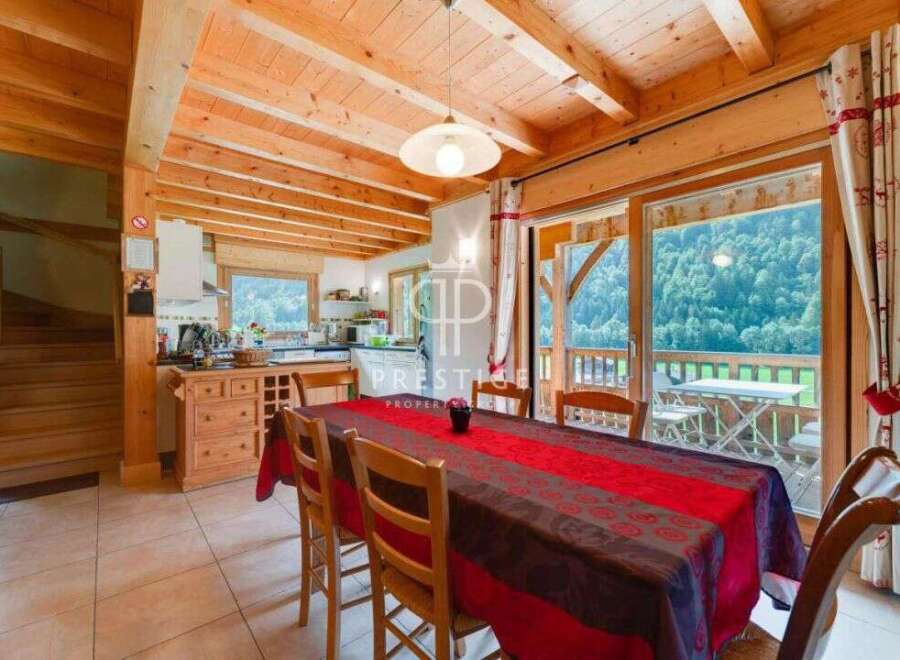 Experience the charm of this stunning property, featuring a warm and inviting interior with exposed wooden beams.