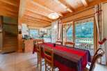Experience the charm of this stunning property, featuring a warm and inviting interior with exposed wooden beams.
