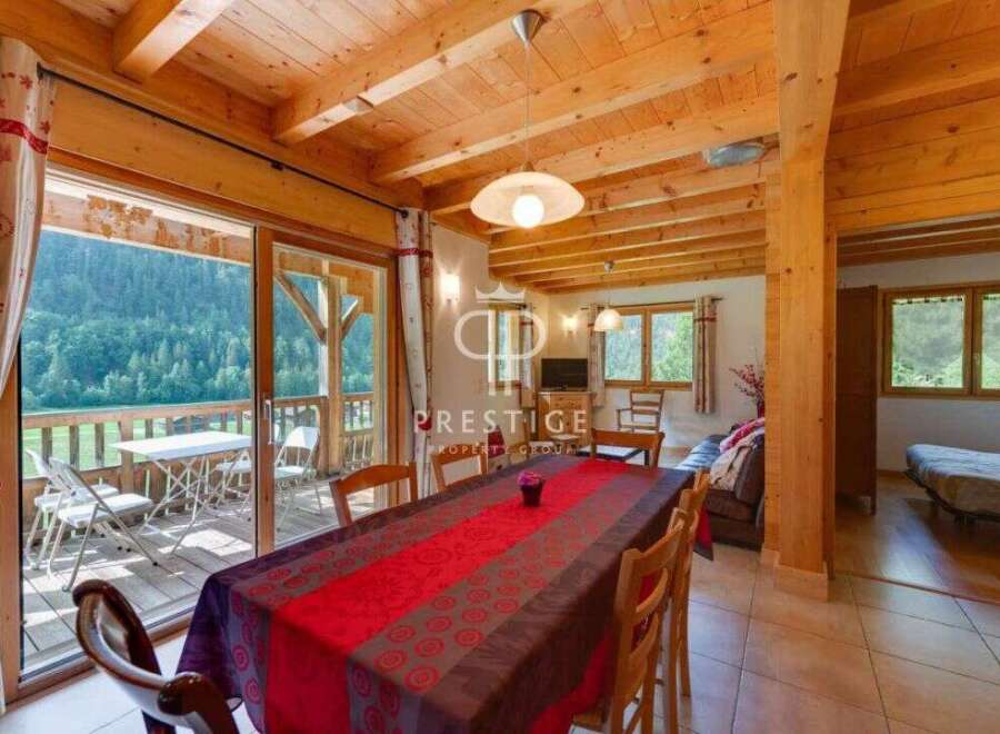 Experience the charm of this stunning property, featuring a cozy dining area perfect for gatherings.