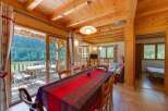 Experience the charm of this stunning property, featuring a cozy dining area perfect for gatherings.