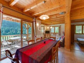 Experience the charm of this stunning property, featuring a cozy dining area perfect for gatherings.