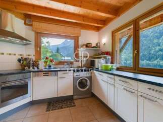 Discover a charming kitchen with stunning mountain views.