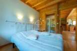 Discover the charm of this cozy bedroom, featuring a comfortable bed and inviting ambiance.