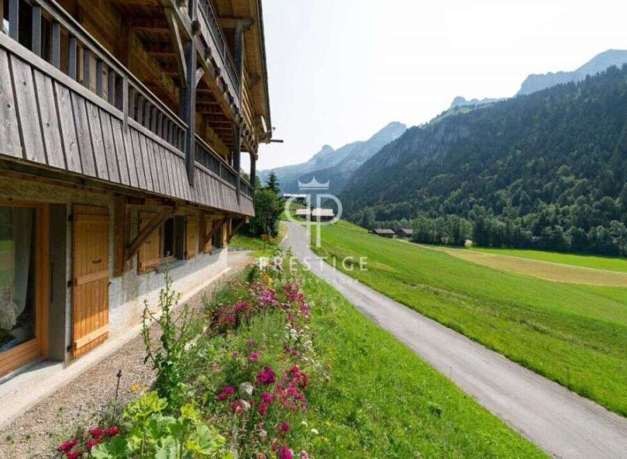 Discover a charming property nestled in a picturesque mountain setting.